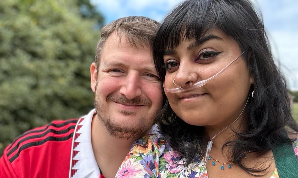 A Man And A Woman With A Nasal Cannula Outside